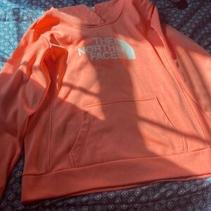 The north face hoodie.    coral color.      Women’s xl. Fits a little small